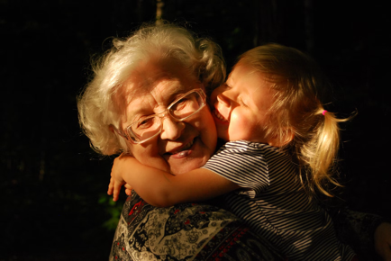 An older lady and a child hugging