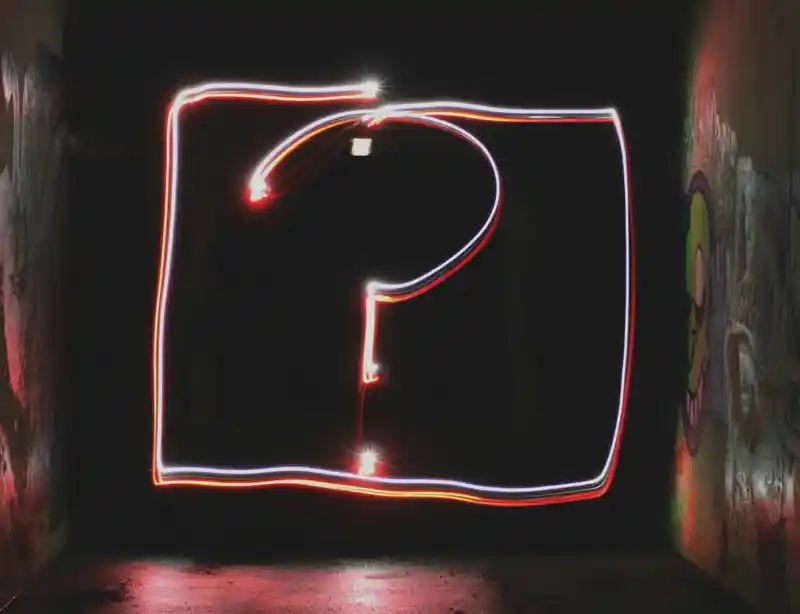 A large stylised question mark